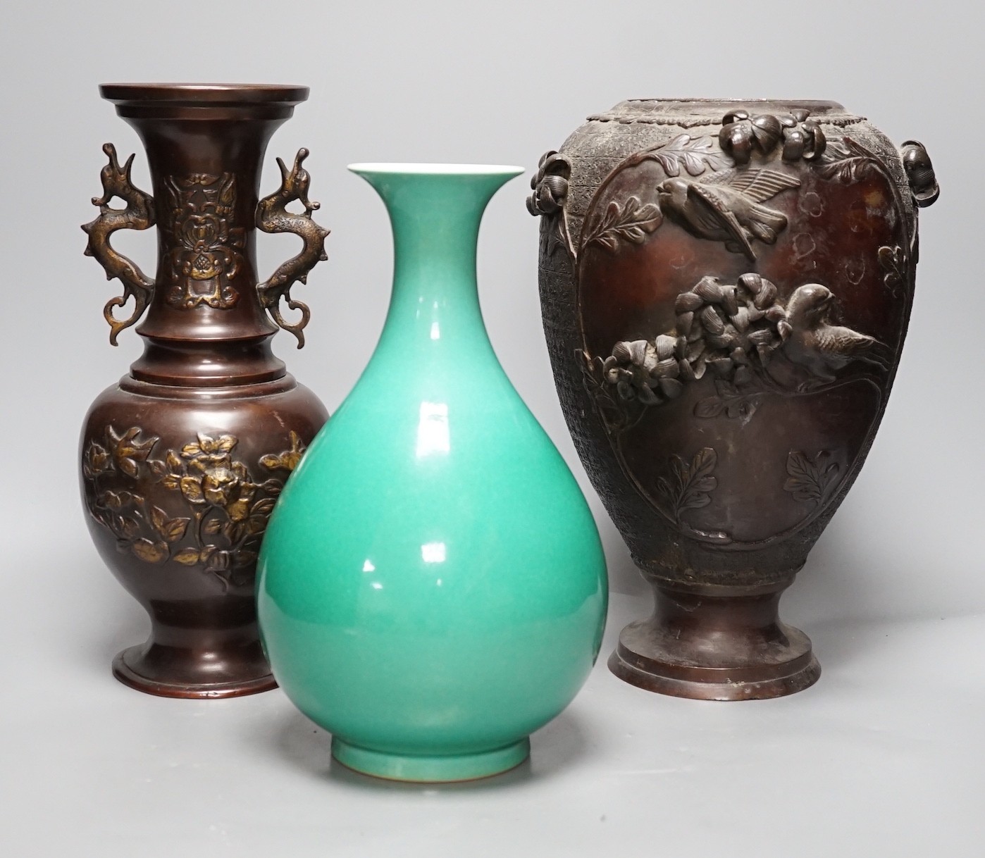 A Chinese green glazed vase with Qianlong seal mark to base and two Japanese bronze vases, tallest 29.5cm